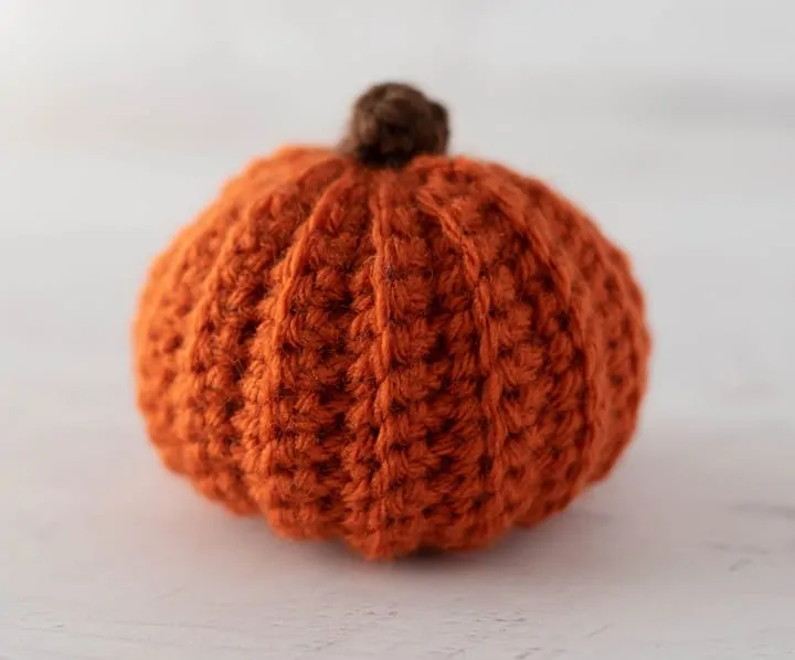 orange crochet pumpkin with brown stem