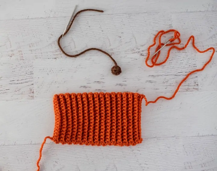 orange and brown crochet pieces