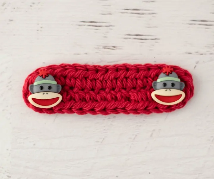 Crochet red Ear saver with monkey buttons