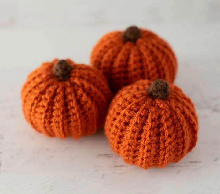 3 orange crochet pumpkins