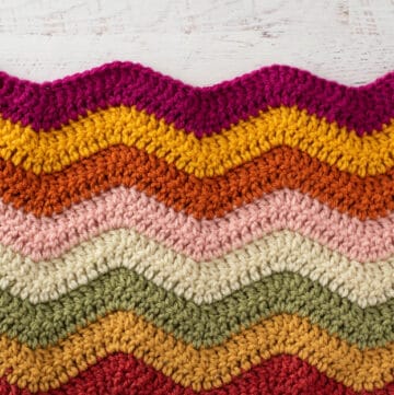 pink, yellow, orange, green and off white crochet afghan sample