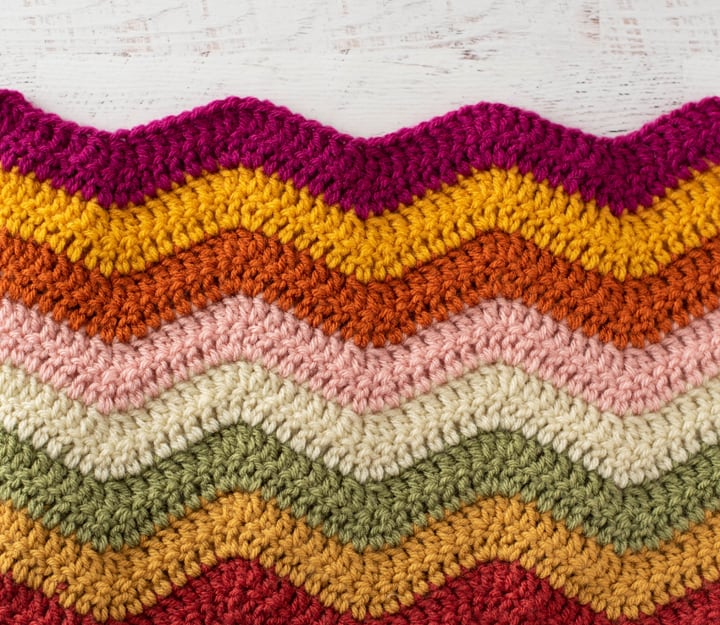 pink, yellow, orange, green and off white crochet afghan sample