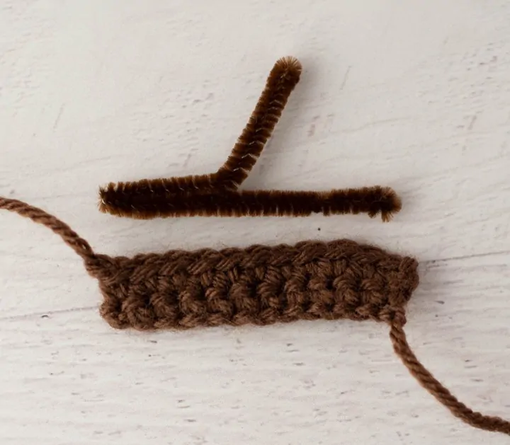 brown pipe cleaner and brown crochet fabric