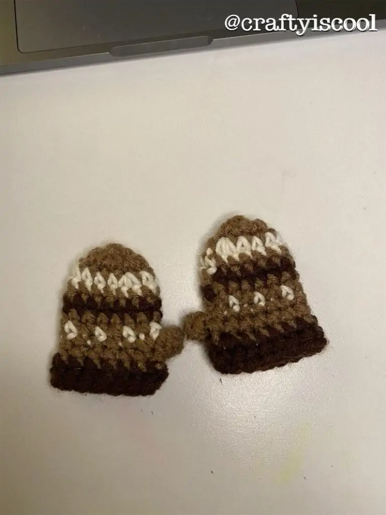 Tiny crochet doll mittens in brown and white