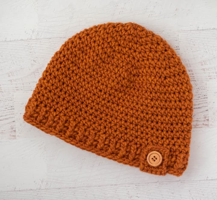 Rust color crochet hat with wood button