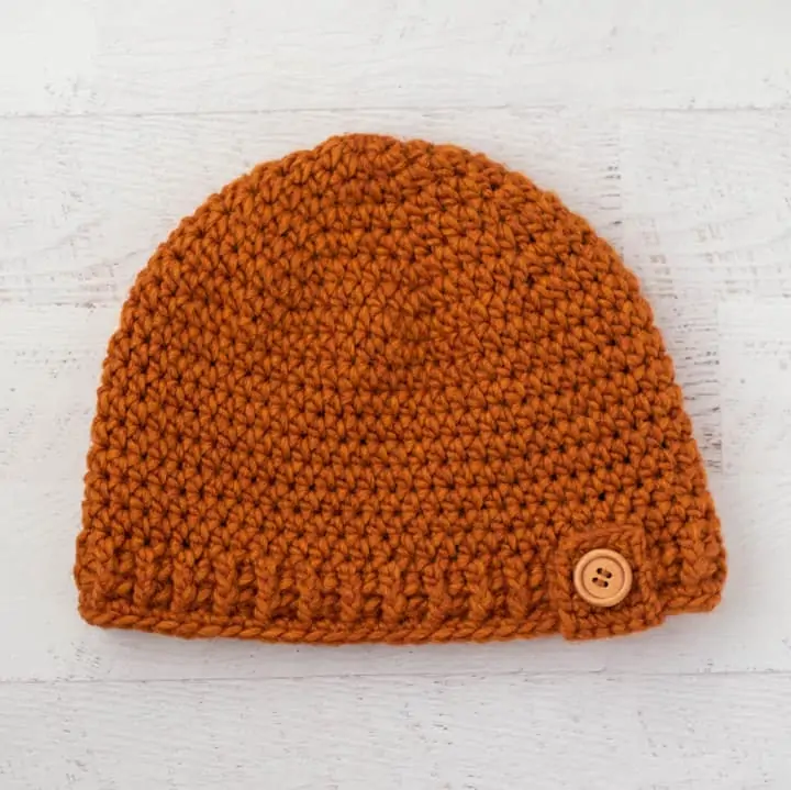 Rust color crochet hat with wood button