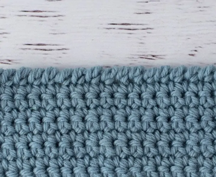 blue crochet piece demonstrating reverse single crochet stitch