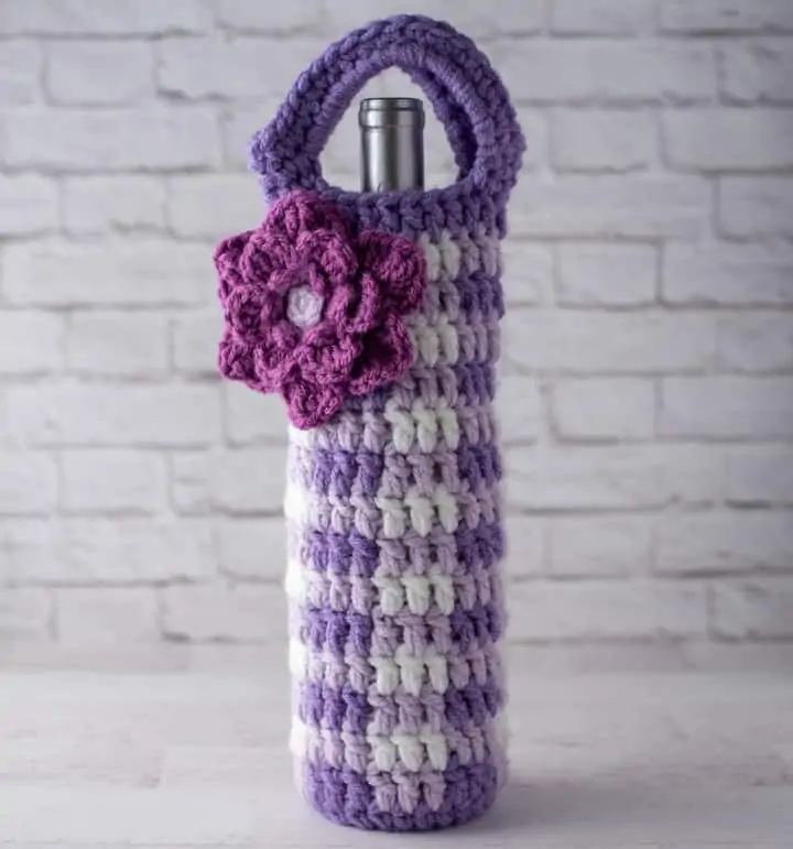 crochet purple gingham wine cozy with large purple flower