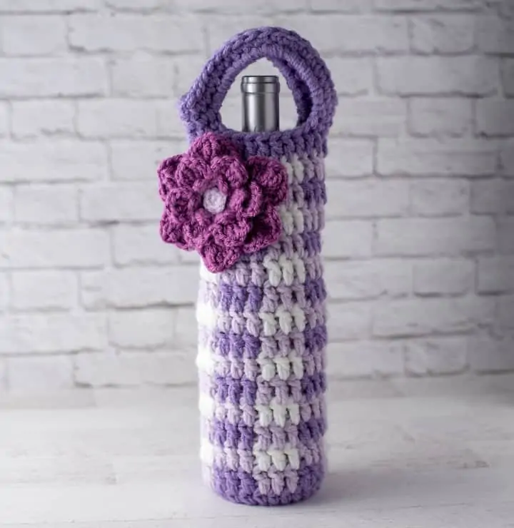 crochet purple gingham wine cozy with large purple flower