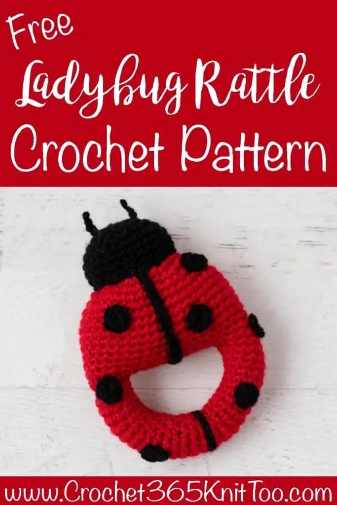 Red crochet ladybug with black spots and head with text