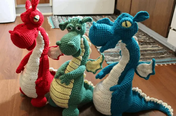 three crochet amigurumi dragons