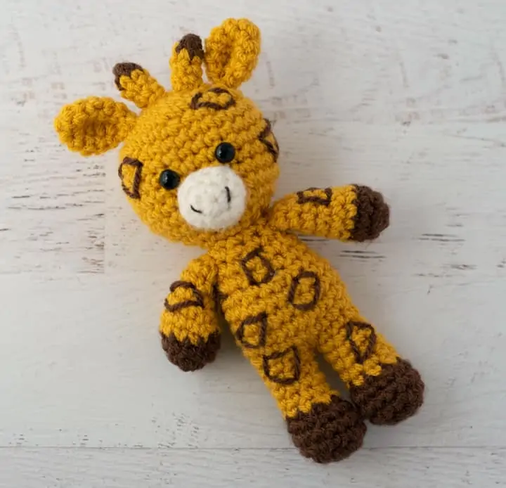 yellow and brown crochet stuffed giraffe