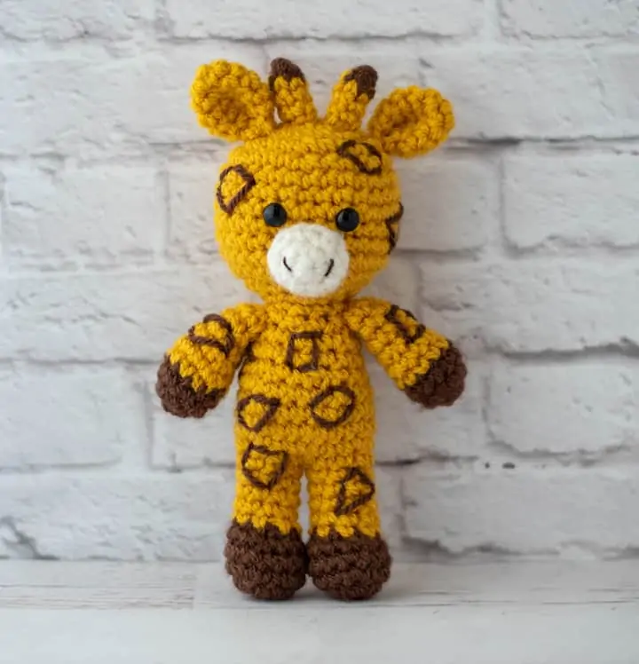 yellow and brown crochet stuffed giraffe