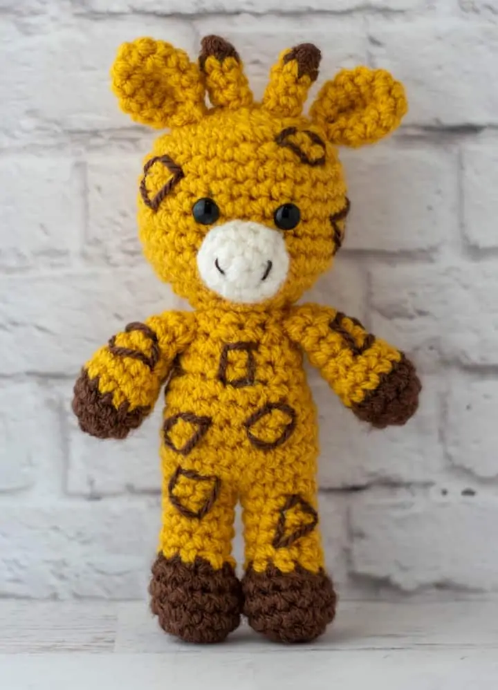yellow and brown crochet stuffed giraffe