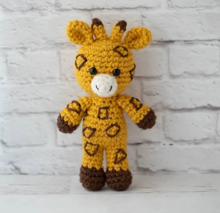 yellow and brown crochet stuffed giraffe