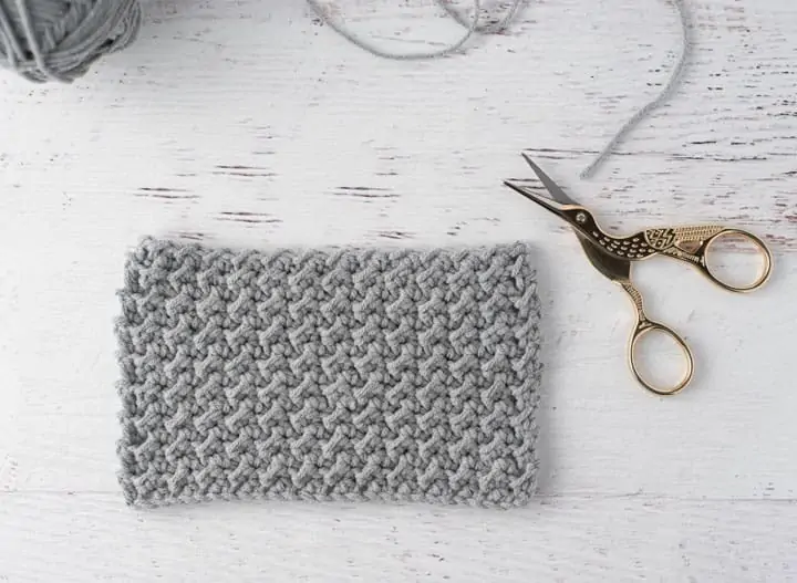 gray crochet sample with stork scissors