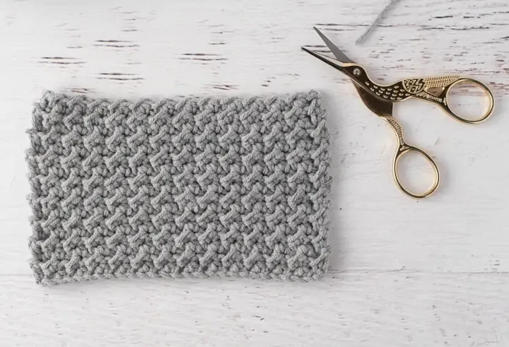 gray crochet sample with stork scissors