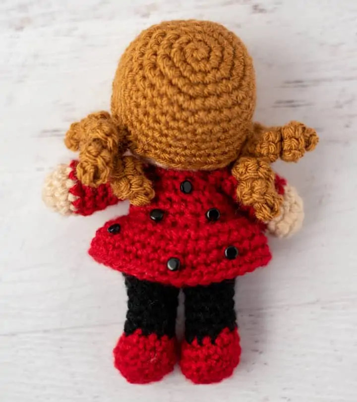 back of crochet doll with gold hair