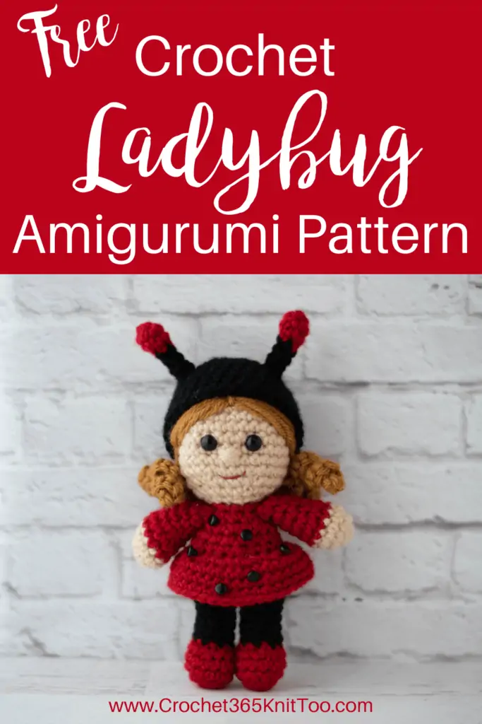 crochet doll with gold hair dressed up as a ladybug with a black hat