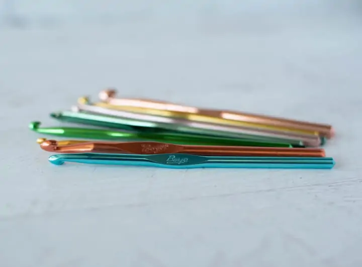 metal crochet hooks on table