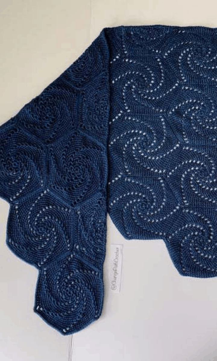 crochet blue shawl with swirls