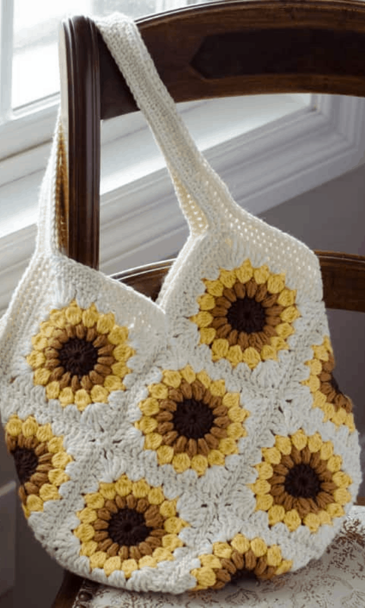 crochet sunflower bag hanging on a chair