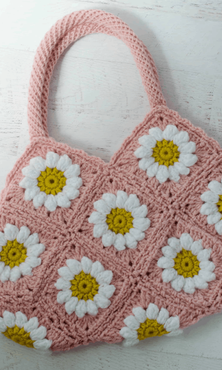 crochet pink bag with daisies on it
