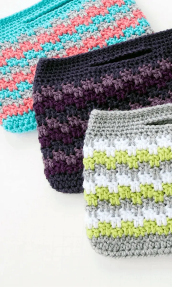 three various colored crochet bags