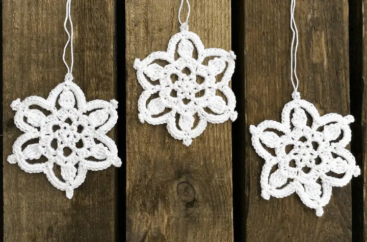 three white crochet snowflakes