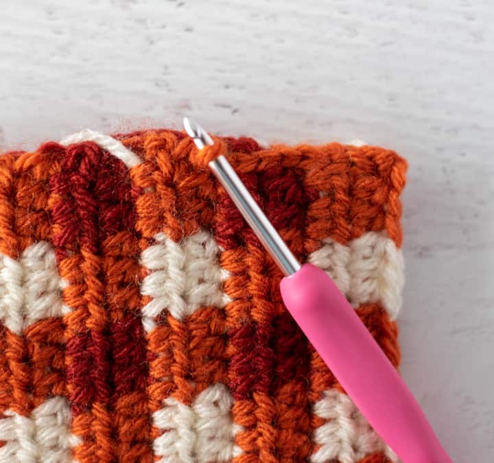 side of crochet rectangle in orange plaid