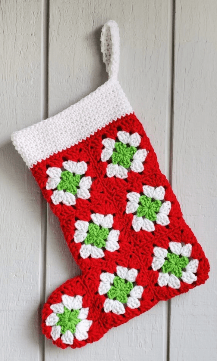 crochet red, white, and green granny square stocking with white trim