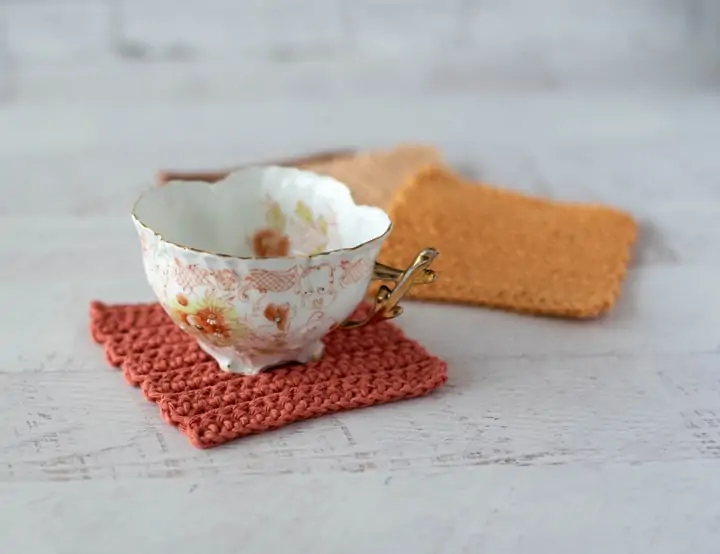 Antique coffee cup on crochet coasters