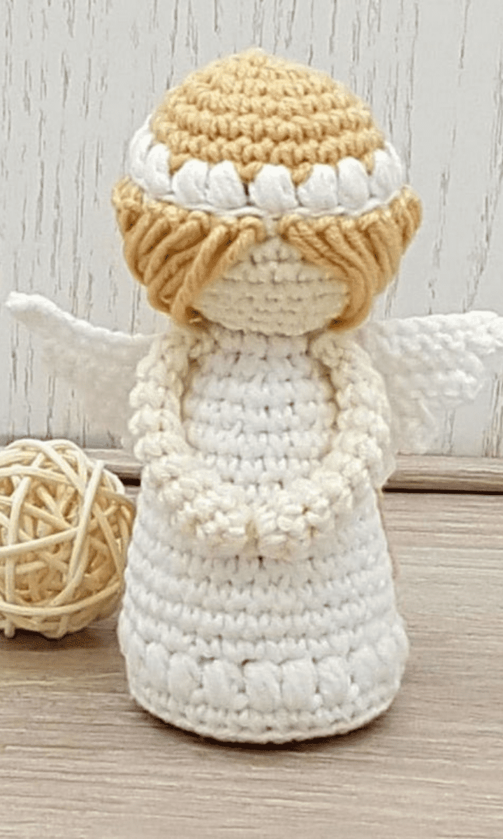 white crochet angel with blonde hair