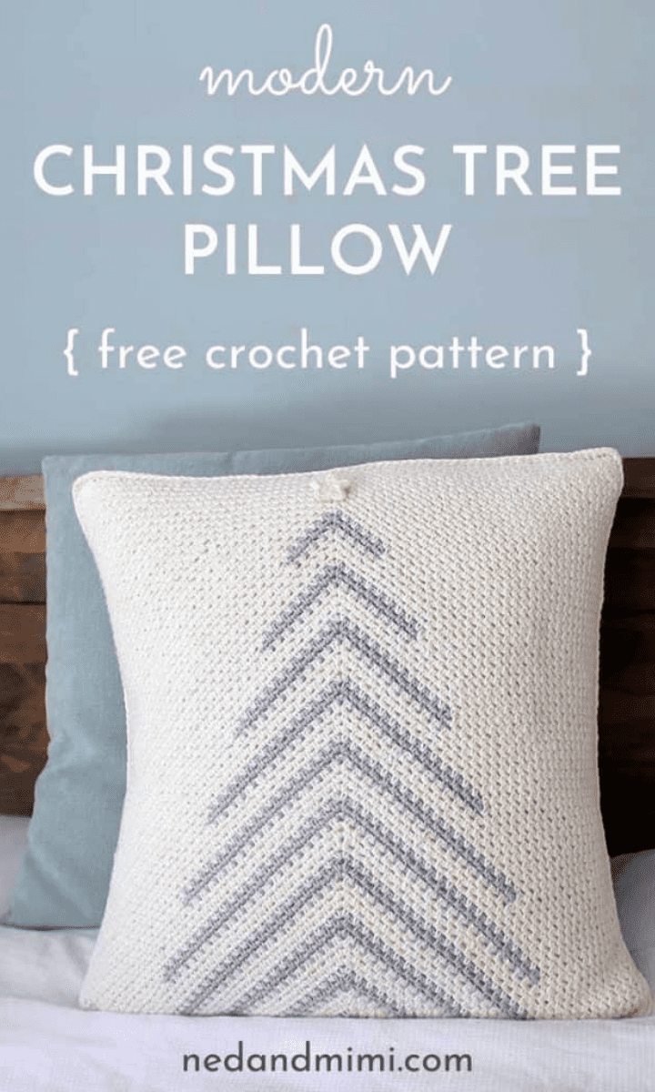 white crochet pillow with grey christmas tree