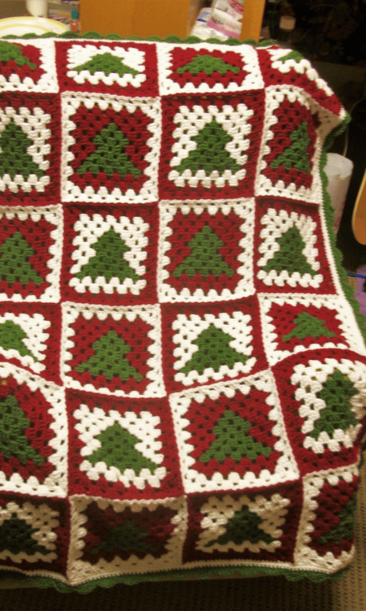 red, white, and green crochet christmas tree granny square blanket