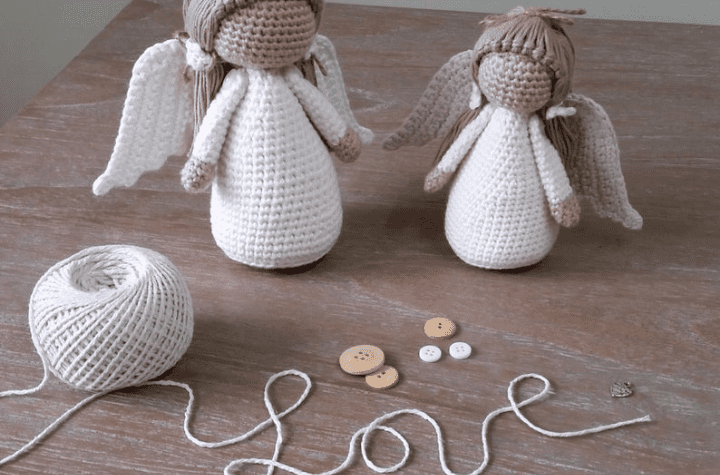 two crochet angel ornaments: one large and one small