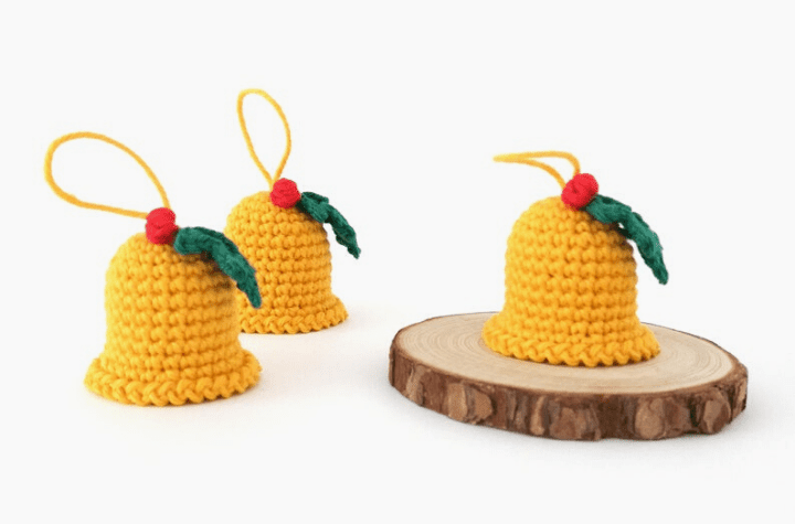 yellow crochet bell ornament with holly