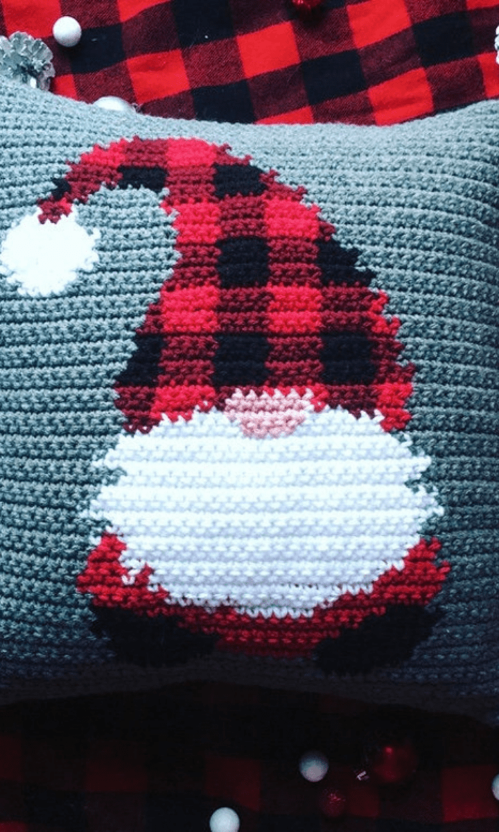 grey crochet pillow with gnome on it