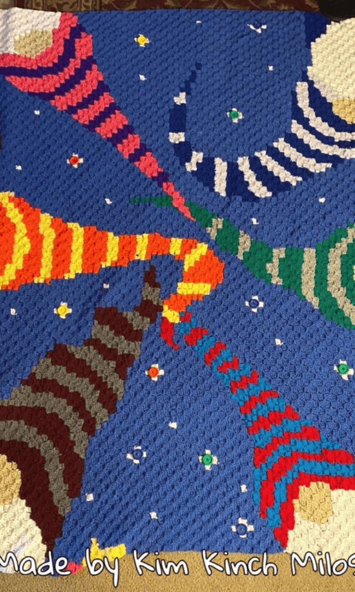 crochet blanket with gnomes on it