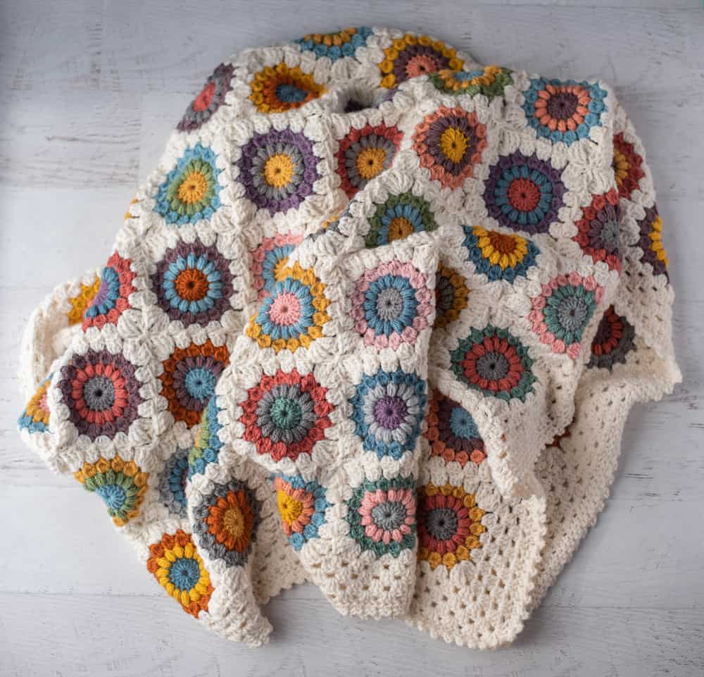 Crochet multi color afghan with ivory border