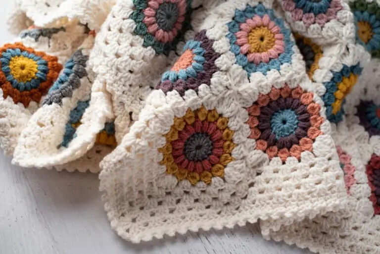 Crochet multi color afghan with ivory border