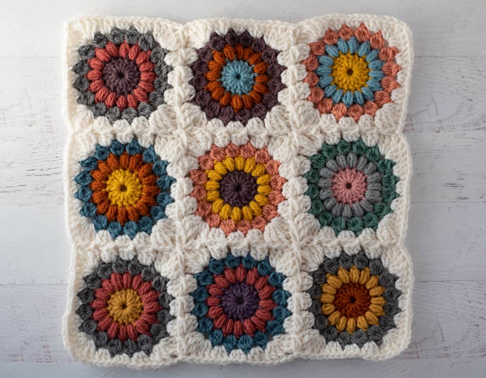 9 joined granny squares in various colors