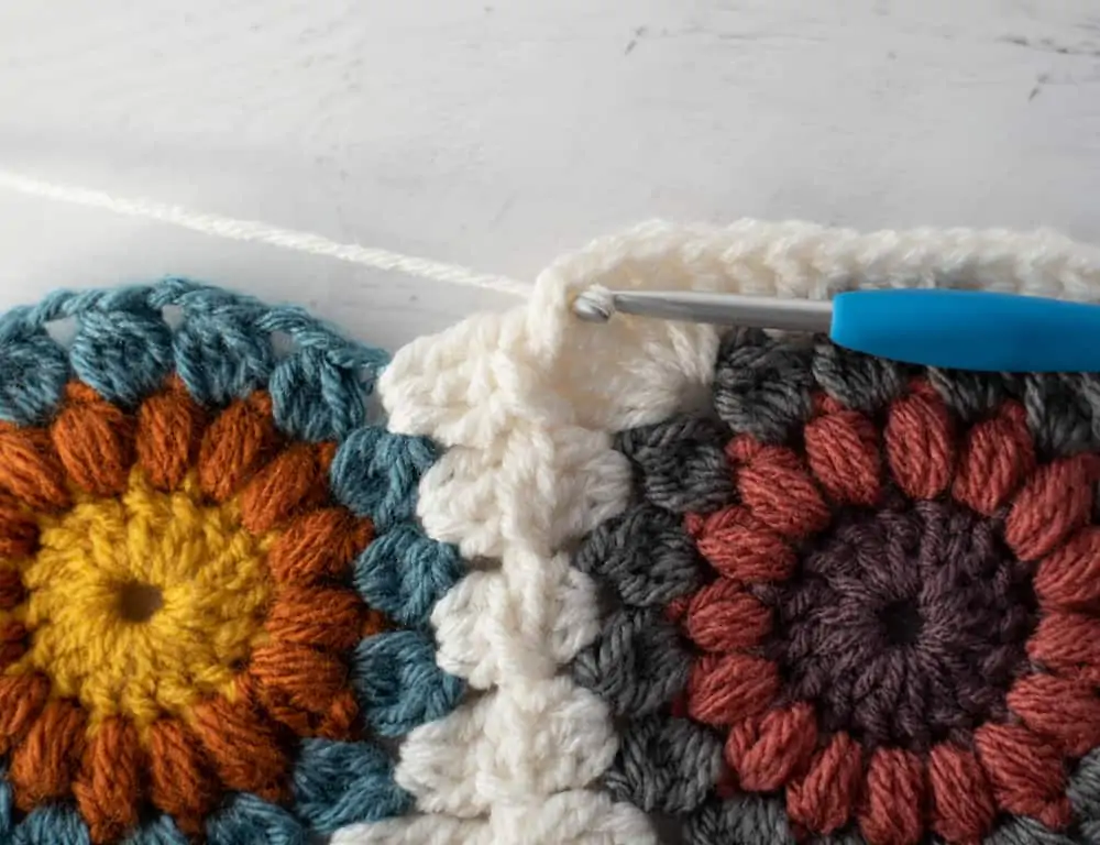 Joining crochet afghan squares with blue crochet hook