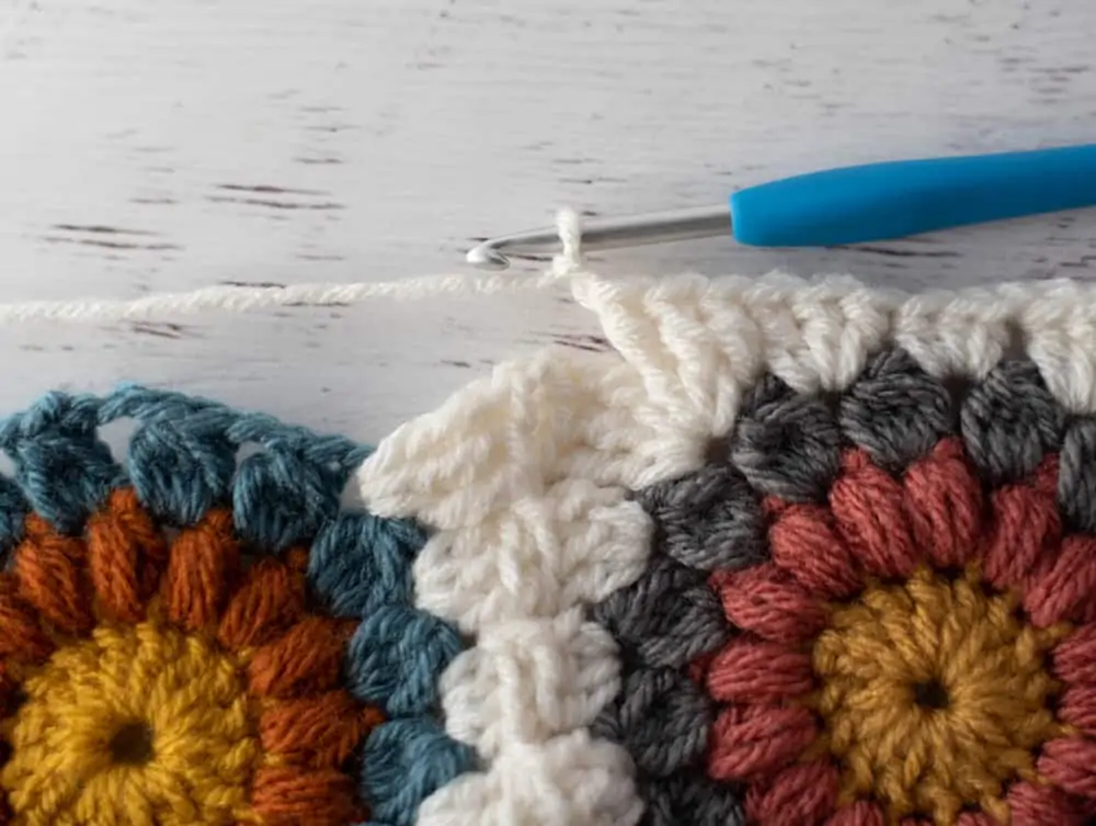Joining crochet afghan squares with blue crochet hook