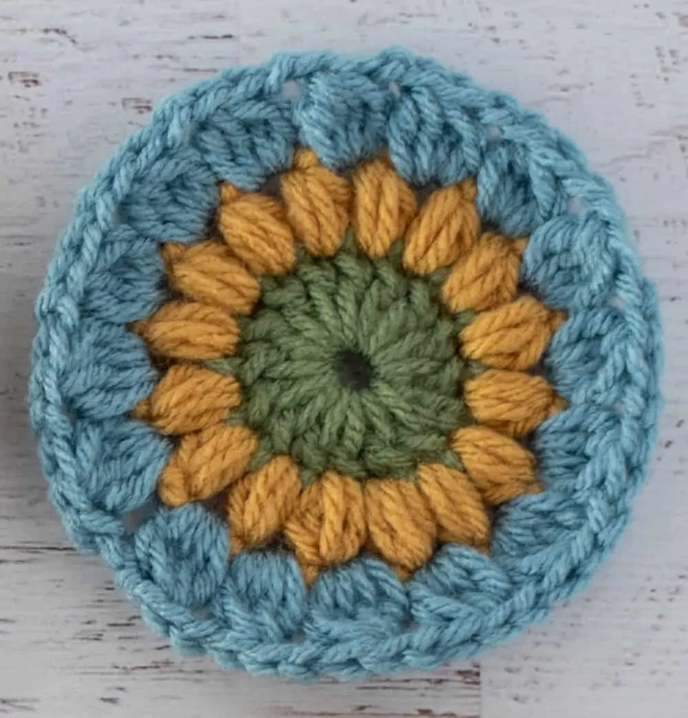 Crochet motif in green yellow and blue yarn