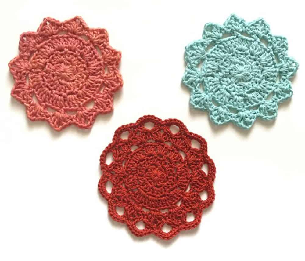 pink, red and blue crochet coasters
