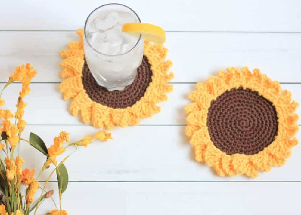 sunflower coasters in yellow and brown with ice water and yellow flowers