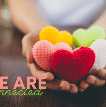 graphic of hands holding crochet hearts in multiple colors with words "we are connected"