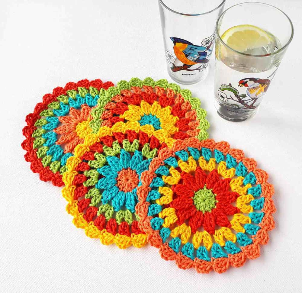 orange, yellow, blue ad red coasters with glasses