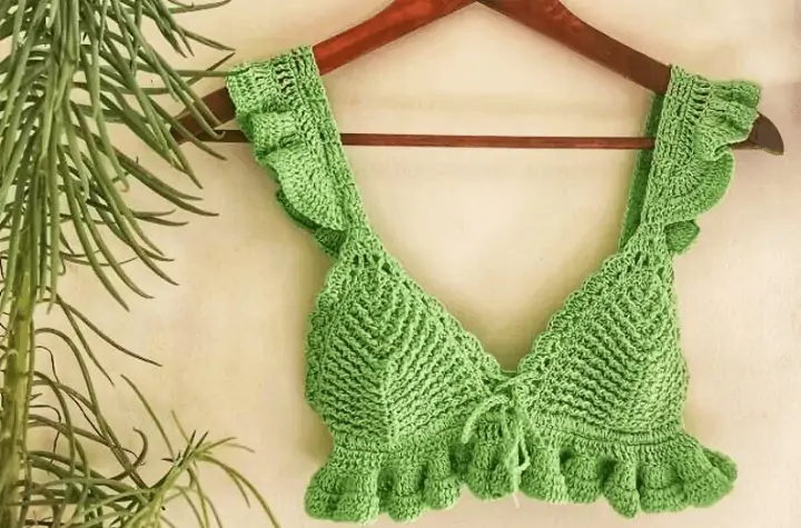 Green bralette with ruffles along the sleeves and bottom